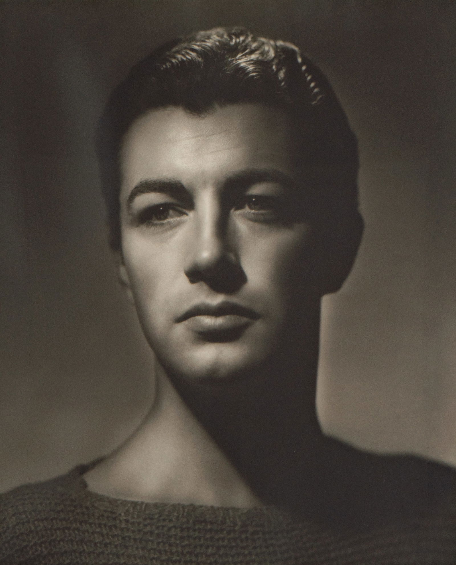 George Hurrell (1904-1992): Robert Taylor: George Hurrell Los Angeles, CA 1904-1992 Johnny Weismuller silver gelatin print (a reprint) ed. 84/250; signed and numbered to lower margin Image: 18 3/4 x 15 1/2 in. (47.6 x 39.4 cm.), Frame: 27 x 22