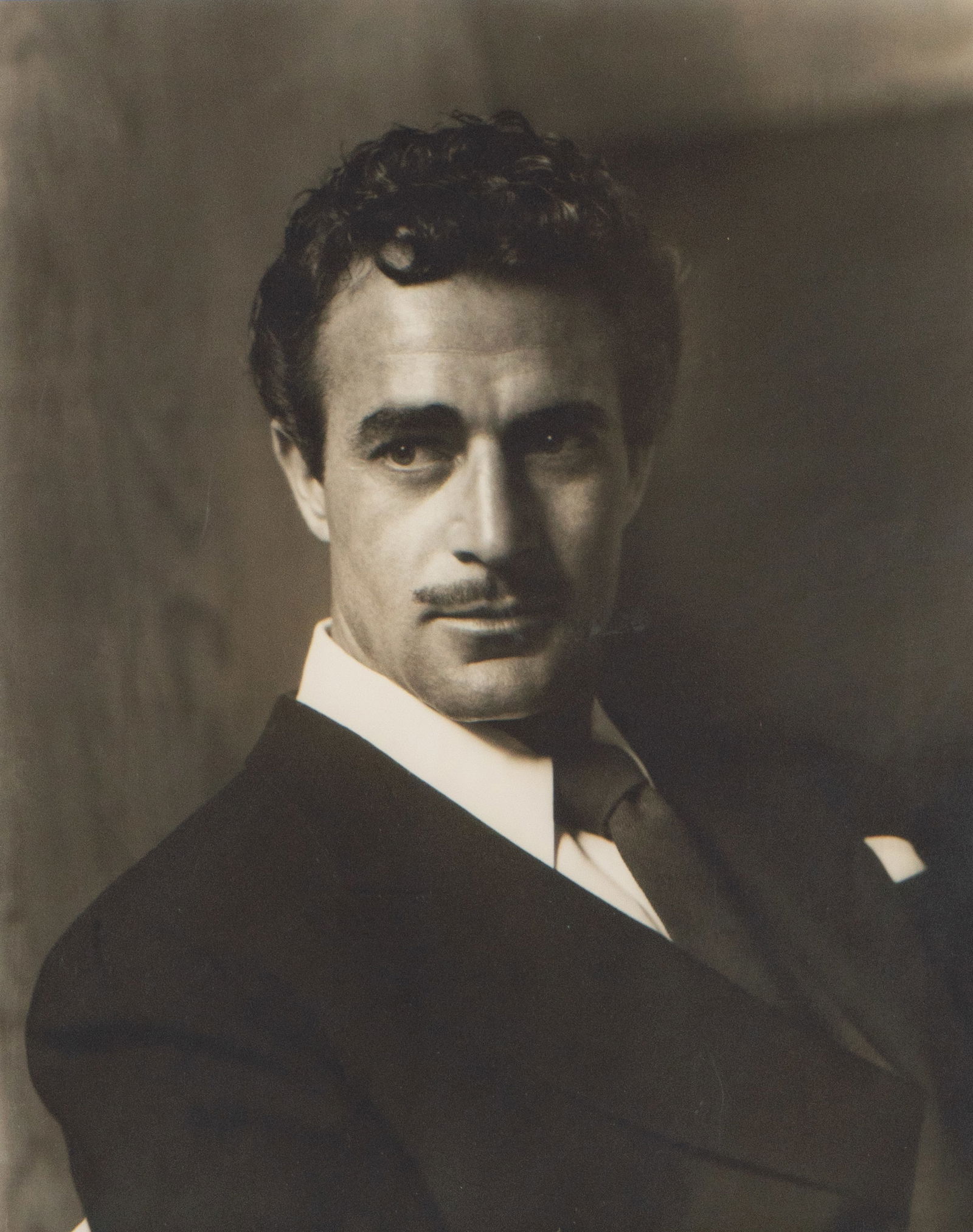 George Hurrell (1904-1992): Gilbert Roland: George Hurrell Los Angeles, CA 1904-1992 Gilbert Roland silver gelatin print (a reprint) ed.44/110; signed and numbered to lower margin Sheet: 14 x 11 in. (35.6 x 27.9 cm.), Frame: 24 1/2 x 20 1/4 in.