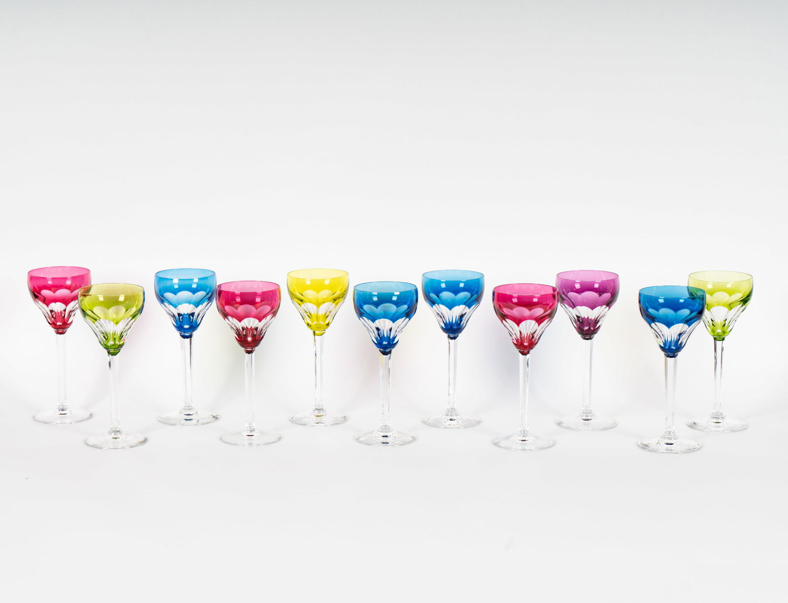 A Set of Val Saint Lambert Colored Crystal Wine Glasses: each marked, 7 3/8 in. high [11 pieces]; together with four associated colored crystal goblets in another pattern, unmarked, 7 1/2 in. high [15 pieces total]