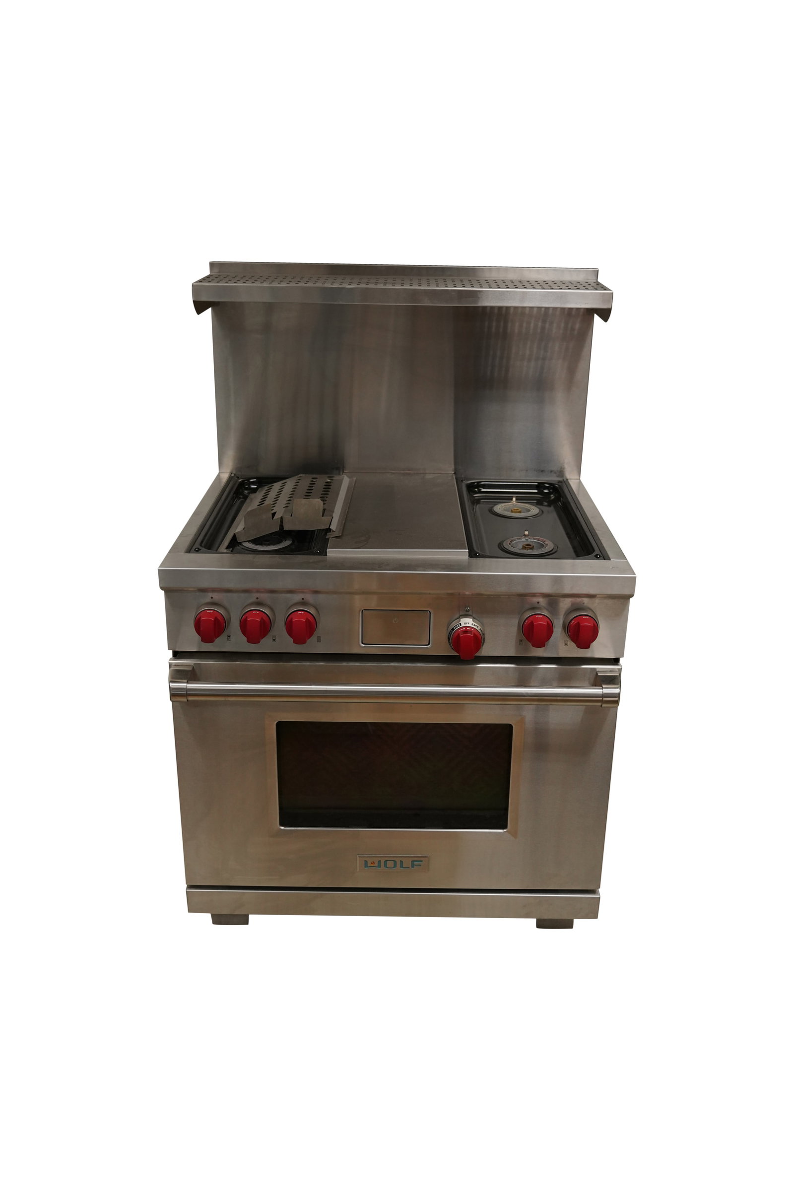 A Wolf Stainless Steel Range: 57 x 36 x 30 in. (144.8 x 91.4 x 76.2 cm.)