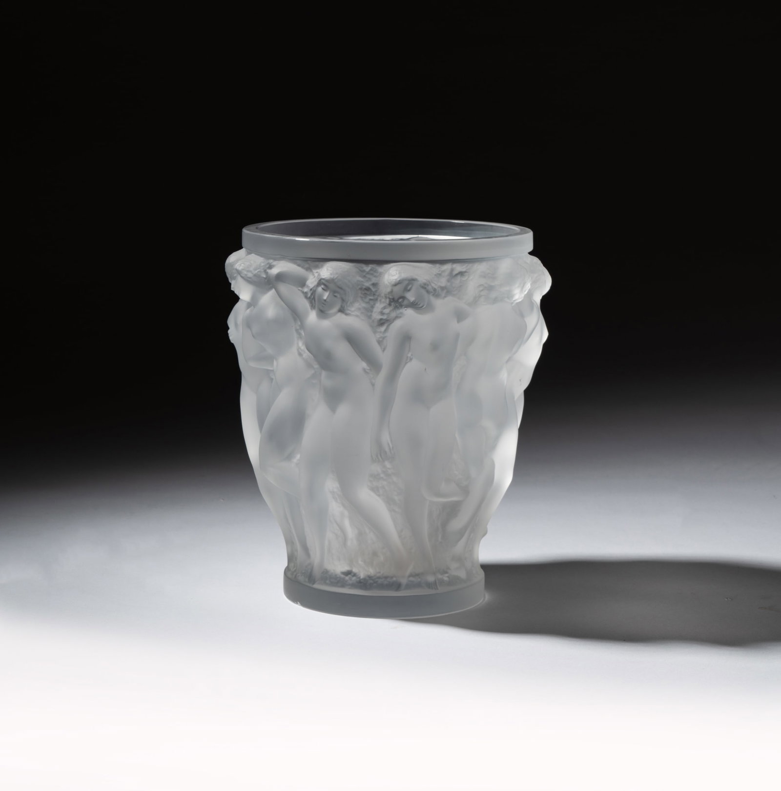 A Lalique Bacchantes Frosted Glass Vase: after 1945; partial "Lalique France" mark to underside 9 3/4 x 8 in. (24.8 x 20.3 cm.)