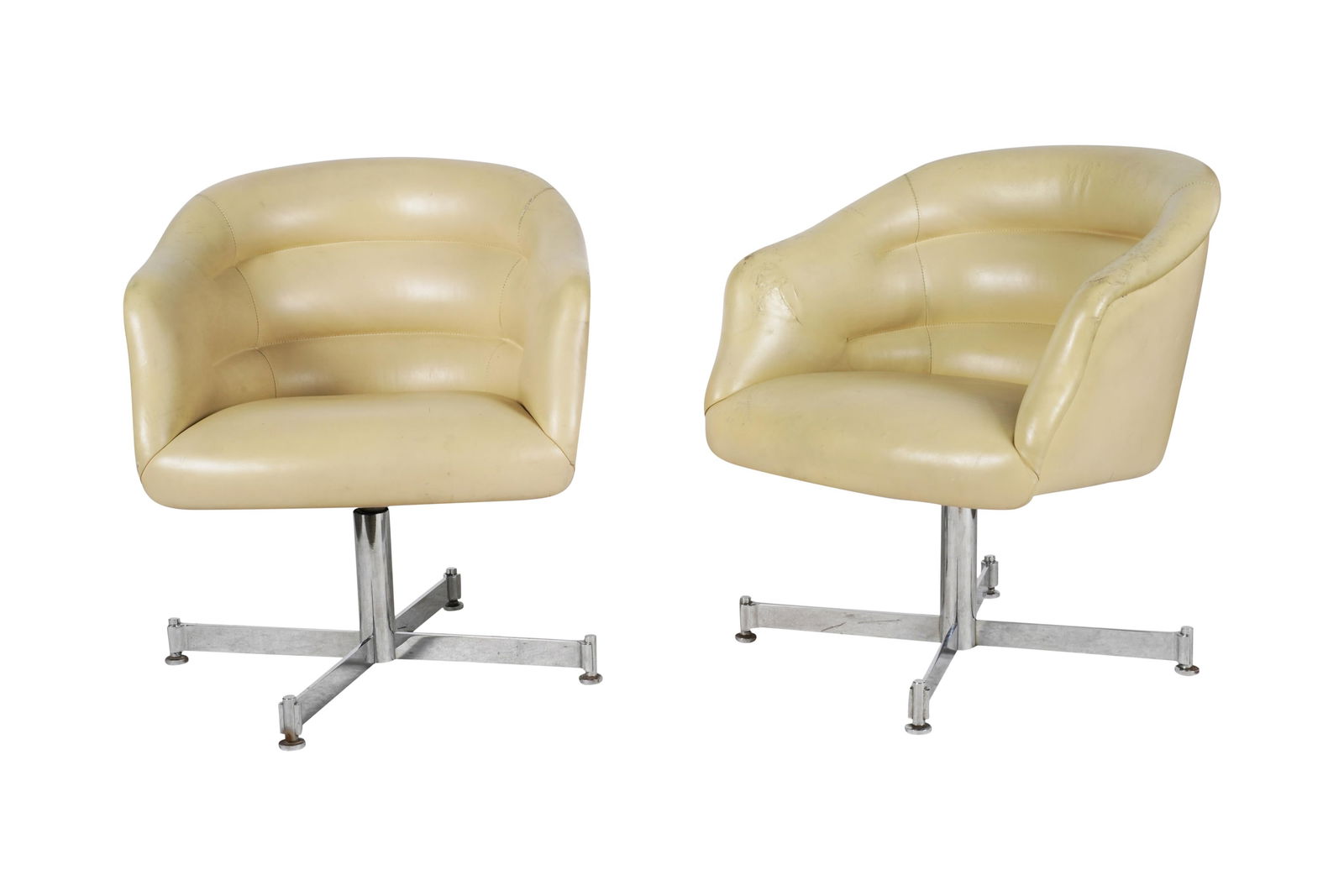 A Pair of Ward Bennett Swivel Chairs: USA, 1970s; chromed steel, vinyl; each with label "Ward Bennett Designs for Brickel Associates" 30 1/2 x 27 x 26 in. (77.5 x 68.6 x 66 cm.), Seat height: 16 in. (40.6 cm.)
