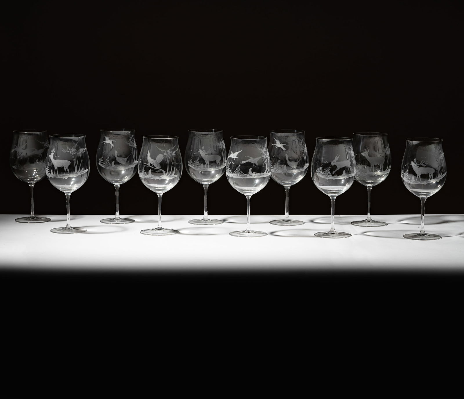 A Set of 10 Etched Wine Glasses: unmarked 10 x 4 1/2 in. (25.4 x 11.4 cm.)