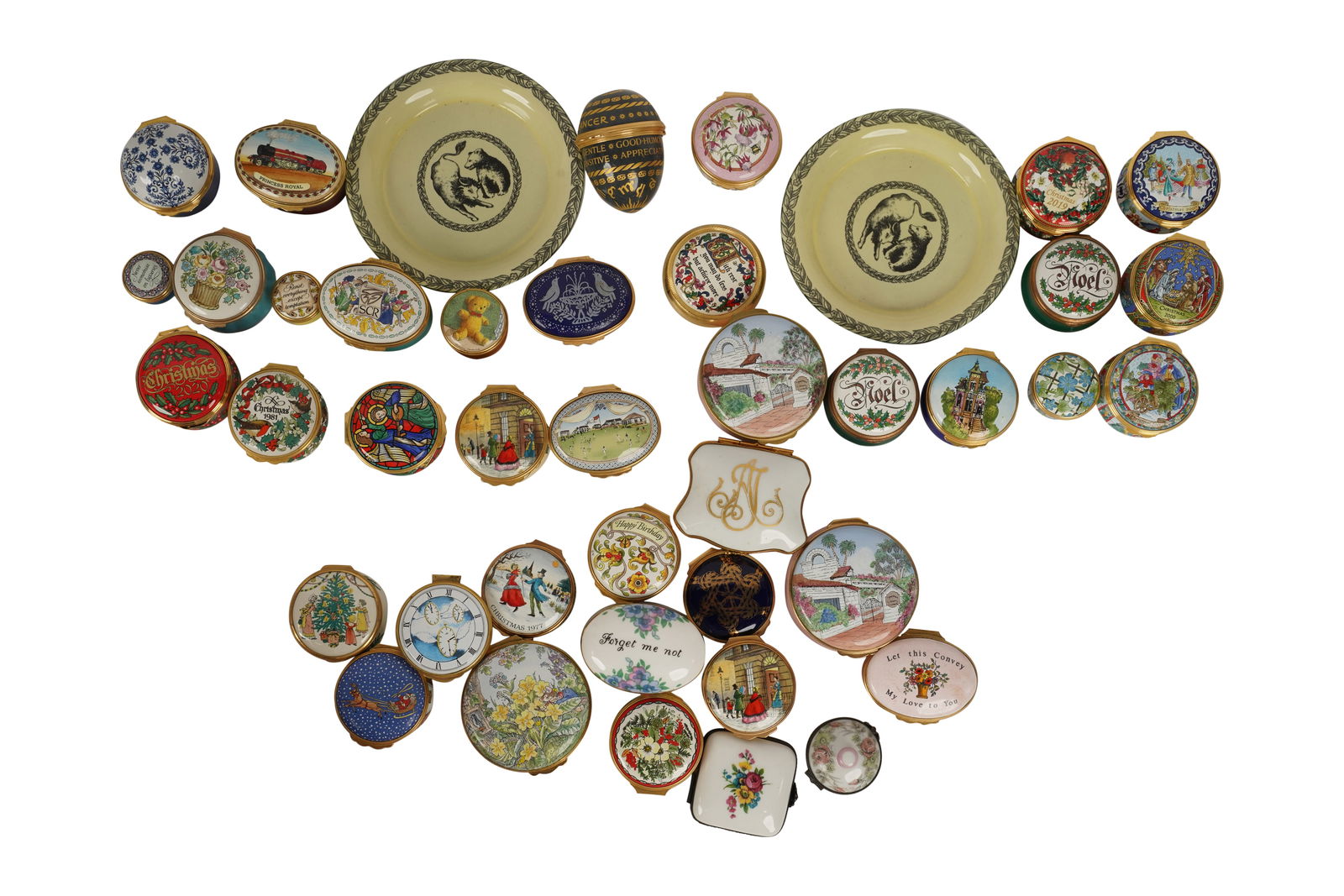 A Collection of 40 Enamel Pill Boxes and Dishes: comprising Halcyon Days, Bilston and Battersea, Crown Staffordshire, Artoria Limoges and more; along with 26 boxes Ranging from 3 in. (7.6 cm.) to 1 in. (2.5 cm.) wide