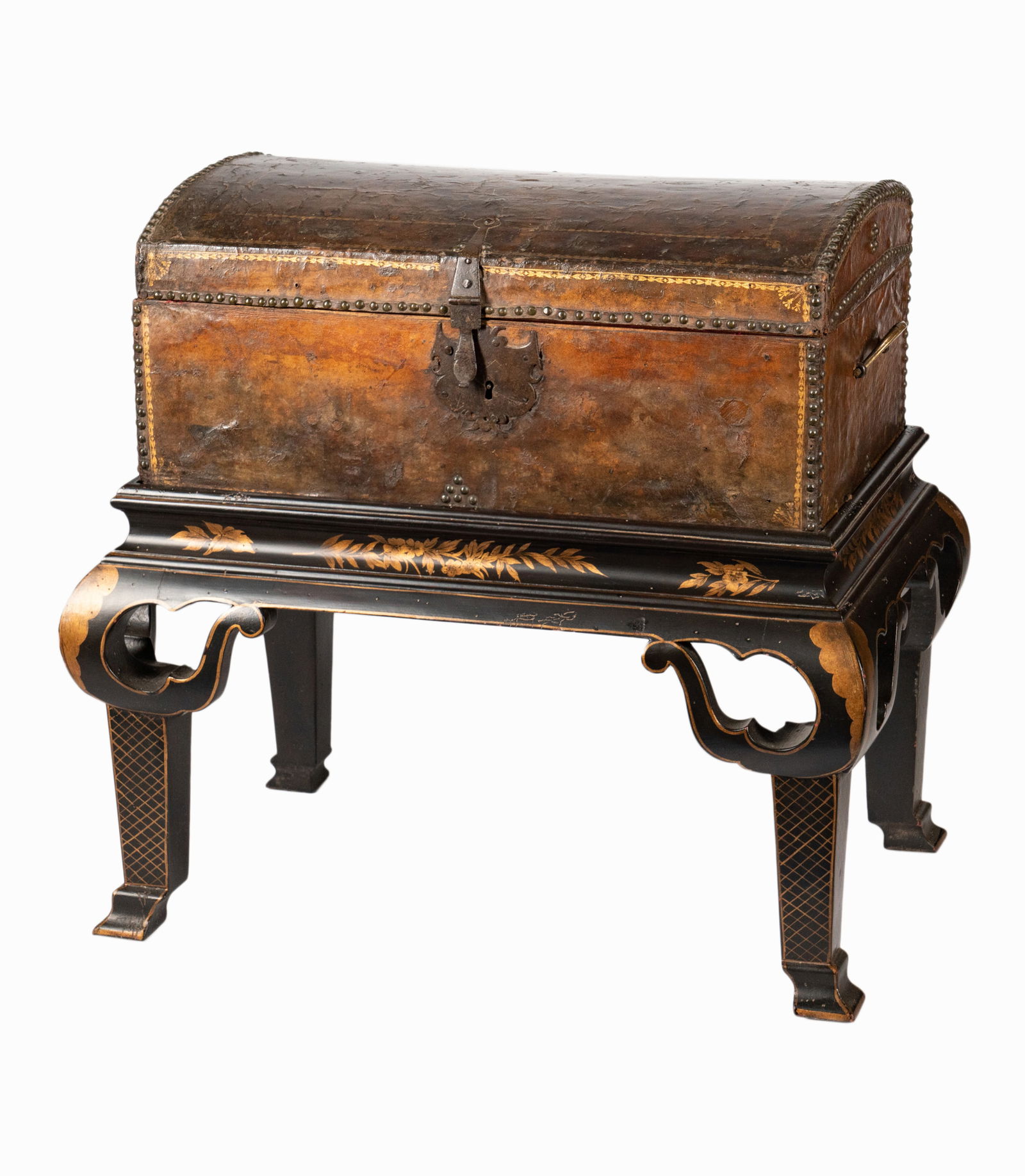 An Italian Baroque Gilt-Tooled Leather Domed Writing Chest: c. 1700; on a later stand Chest: 9 x 20 x 12 in. (22.9 x 50.8 x 30.5 cm.), Overall: 22 x 23 x 15 in. (55.9 x 58.4 x 38.1 cm.) Provenance: with Rossi Antiques and Custom Furniture, San Francisco, Calif