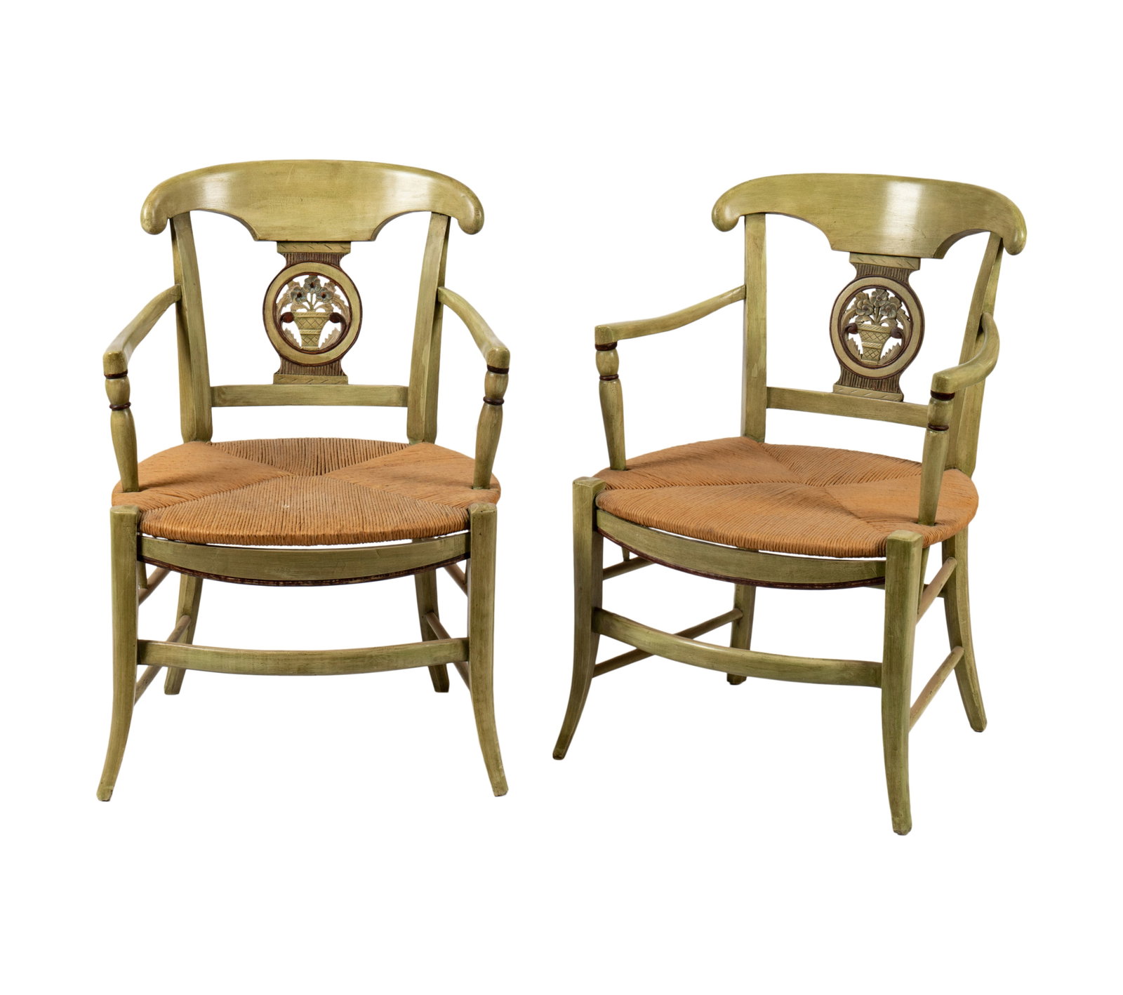 A Pair of French Neoclassical Provincial-Style Green-Painted Armchairs: each with woven rush seat 31 x 21 x 20 in. (78.7 x 53.3 x 50.8 cm.), Seat height: 15 in. (38.1 cm.) Provenance: Rossi Antiques and Custom Furniture, San Francisco, California