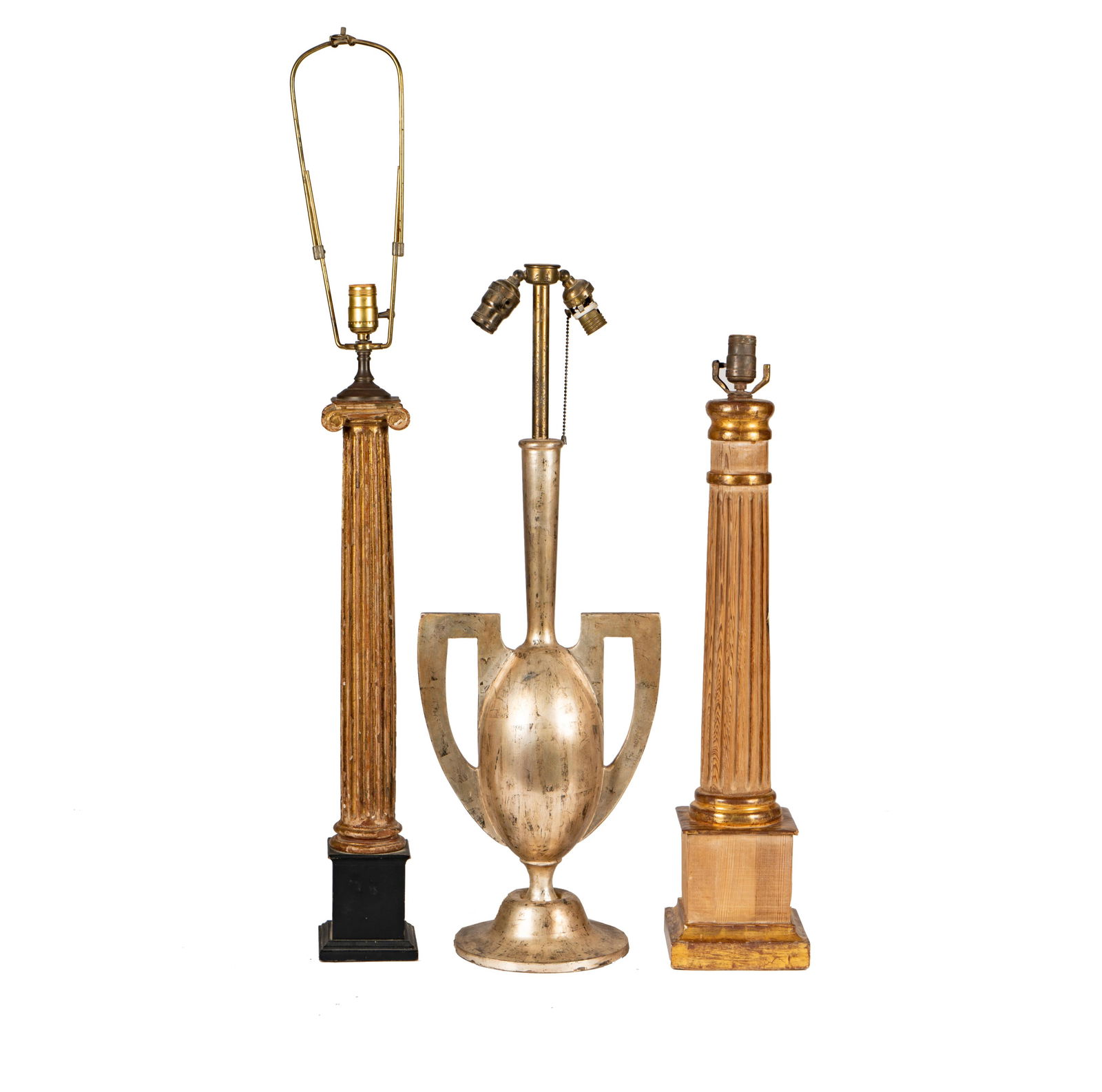 Group of Three Neoclassical-Style Lamp Bases: comprising one silvered wood and two giltwood Ranging from 28 1/2 in. (72.4 cm.) high to 32 in. (81.3 cm.) high (excluding harps) Provenance: Rossi Antiques and Custom Furniture, San Francisco, Califo