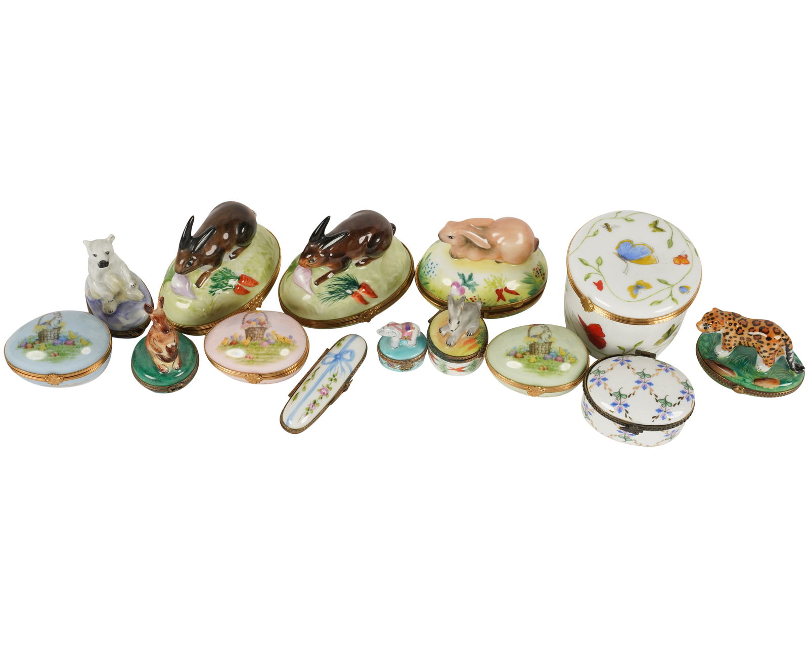 A Group of Limoges Porcelain Pill Boxes: Ranging from 1/2 in. (3.8 cm.) high to 2 1/2 in. (6.4 cm.) high [14 pieces]