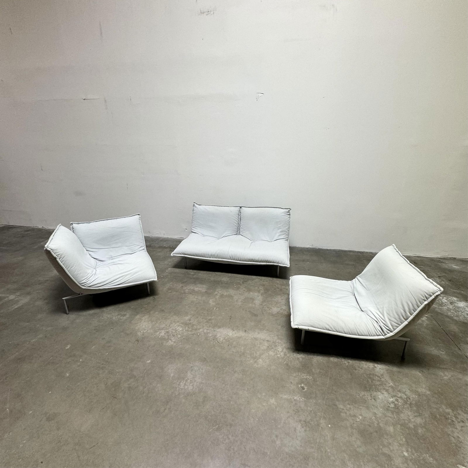 Pascal Mourgue for Cinna: Calin Sofa Set: c. 1995, designed 1994; fabric, high-density polyurethane foam, steel grey-finish aluminum Double Sofa: 29 1/2 x 65 x 39 1/2 in. (74.9 x 165.1 x 100.3 cm.), Seat Height: 13 1/2 in. (34.3 cm.) Note; Th
