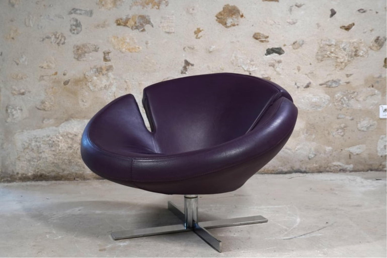 Robert Tapanassi and Maurizio Manzoni for Roche Bobois: Signet Chair: 2011, France, in purple, swivels 360 degrees 25 1/2 x 36.6 x 33 in. (64.8 x 93 x 83.8 cm.)