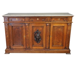 A Victorian Carved Walnut Marble-Top Sideboard
