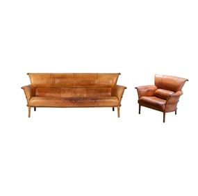 A Western-Style Brown Leather Sofa and Lounge Chair
