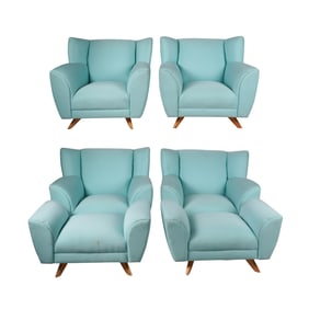 A Set of Four Lounge Chairs with Two Ottomans