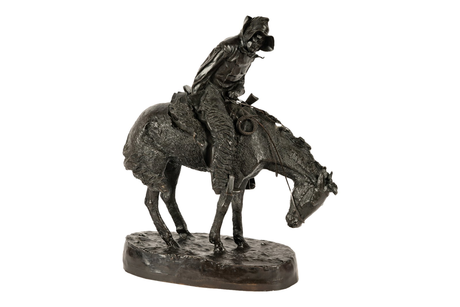 After Frederick Remington: The Northerner: patinated bronze; inscribed "Frederic Remington" to base (no foundry mark) 20 3/4 x 17 x 8 in. (52.7 x 43.2 x 20.3 cm.)