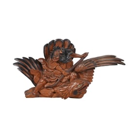 A Japanese Wood Carving of a Samurai on an Eagle