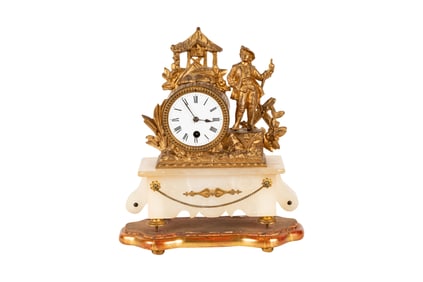 A Gilt Metal and Onyx Figural Mantel Clock