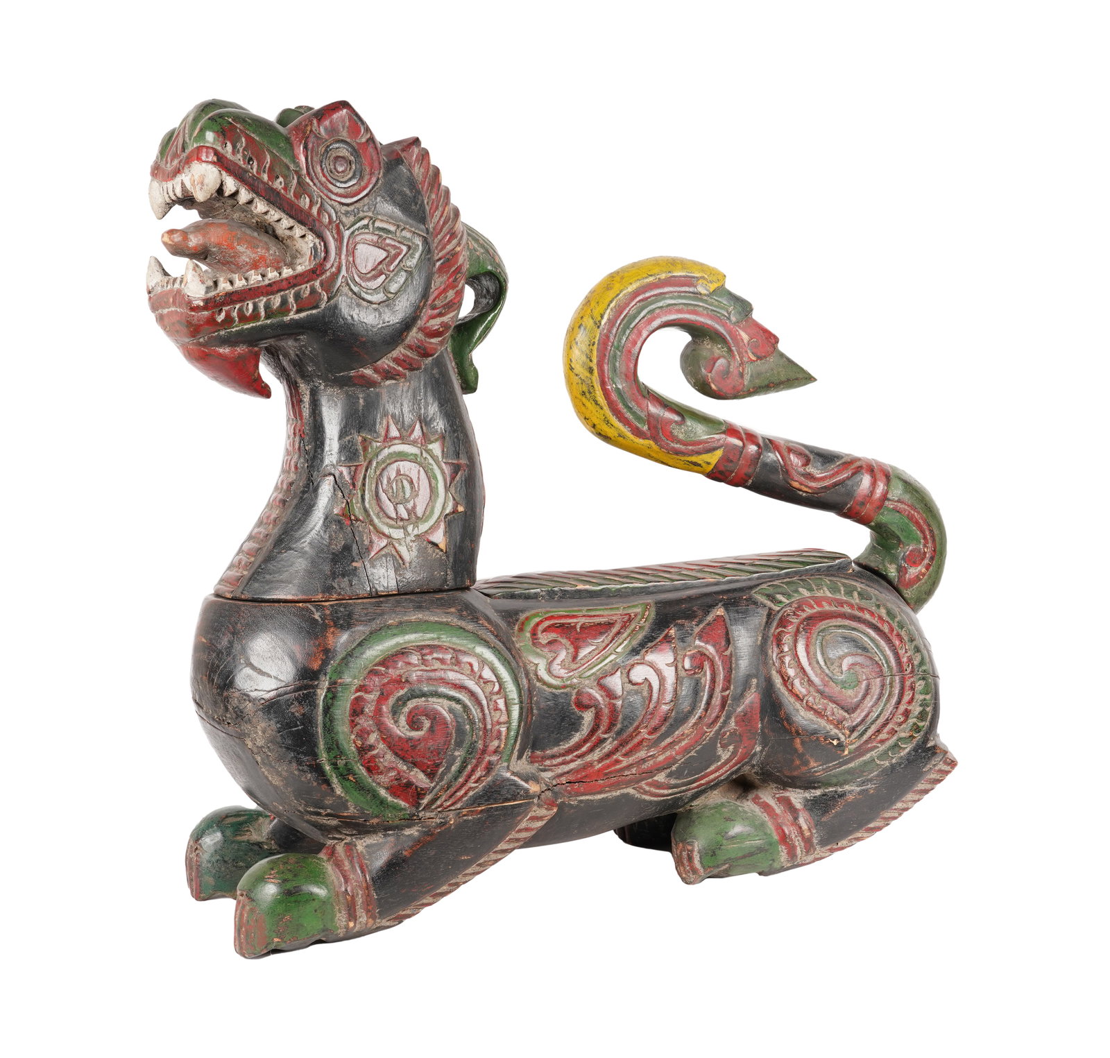 An Asian Carved And Painted Wood Animal Figure: the head and tail removable from the body 31 x 32 x 13 in. (78.7 x 81.3 x 33 cm.) Provenance: The Estate of Film, Television, and Broadway Producer Martin Starger