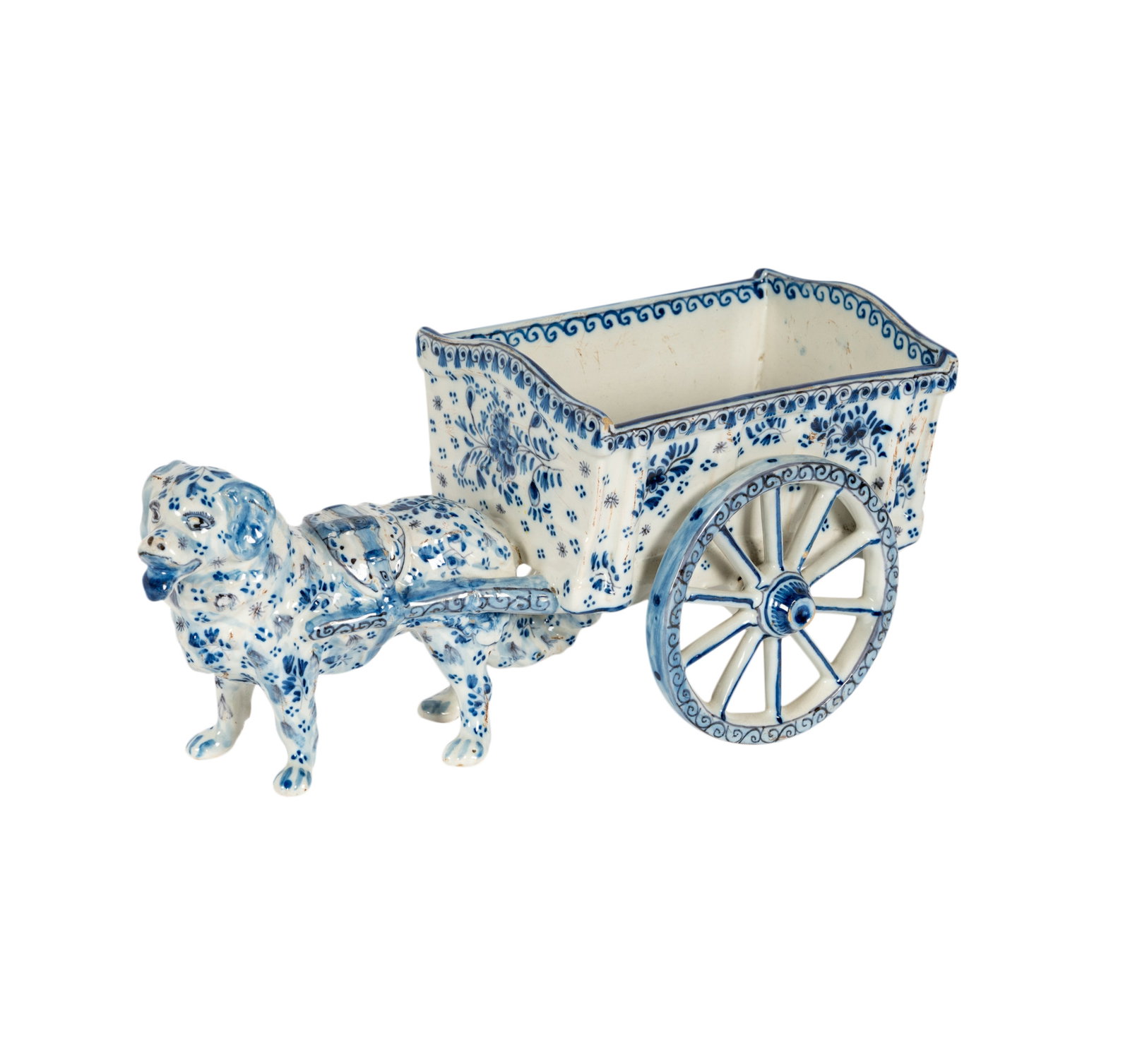 A Delft Pottery Dog Cart-Form Cachepot: painted mark "Delft" 5 1/4 x 11 1/2 x 5 1/2 in. (13.3 x 29.2 x 14 cm.)