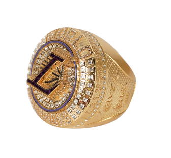 A Lakers 2020 Championship Paperweight: made for season ticket holders; gold tone with faceted imitation stones 3 1/4 x 3 x 4 in. (8.3 x 7.6 x 10.2 cm.)