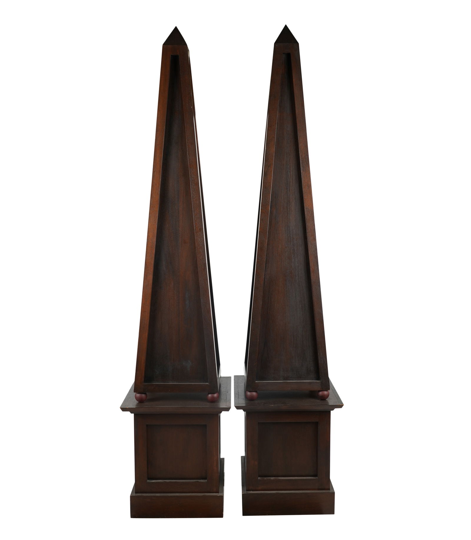 A Pair of Mahogany Obelisks on Pedestals: second half 20th century; each in two parts Each overall: 80 x 18 x 18 in. (203.2 x 45.7 x 45.7 cm.) Provenance: Property from J. J. Blick's Lukenheimer House, Pasadena, California