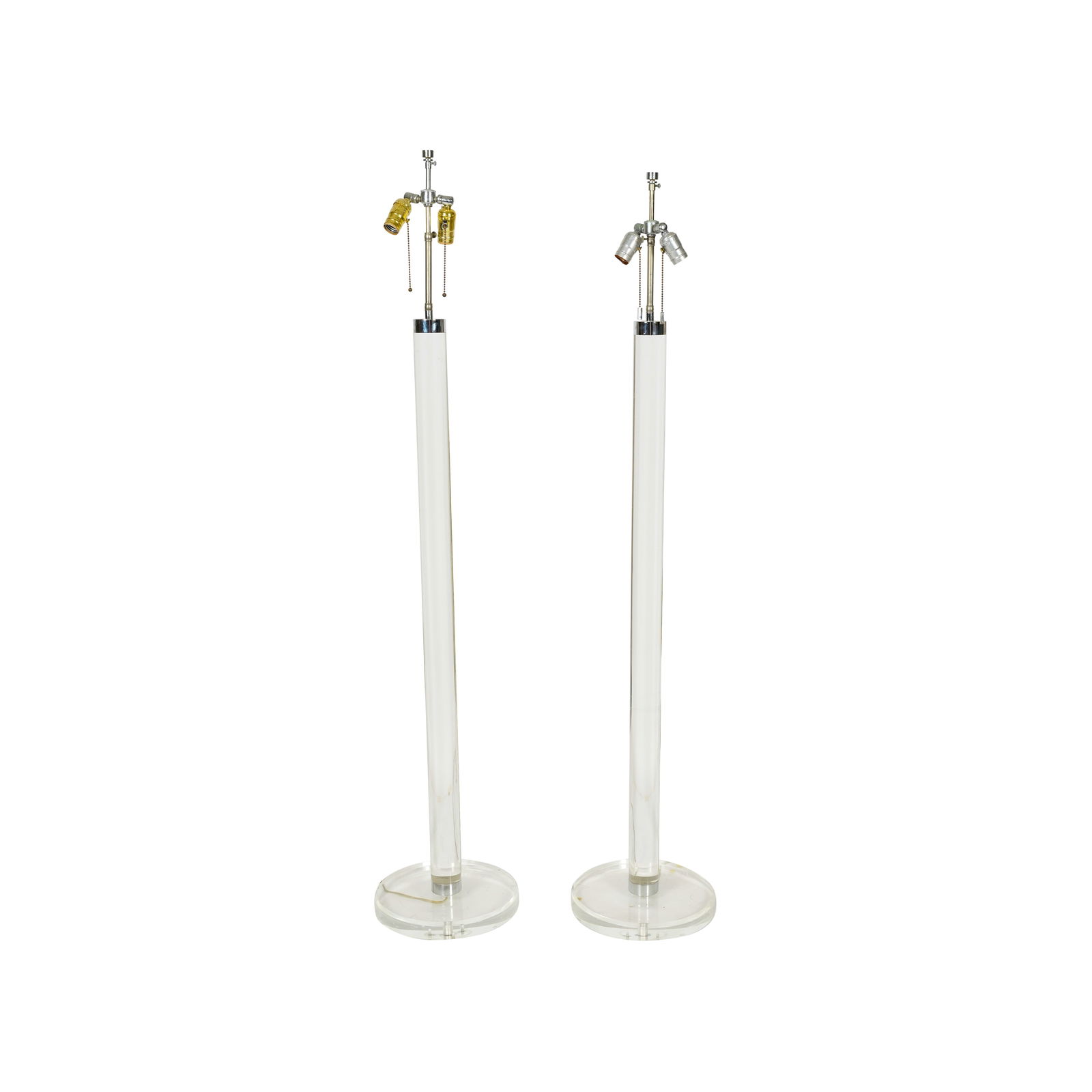 Karl Springer (1931 - 1989): Pair of Floor Lamps: Lucite, chromed metal; 60 x 12 in. (152.4 x 30.5 cm.) Provenance: The Estate of American Pop Icons Steve Lawrence and Eydie Gorme, purchased Sept 11, 1978 (with copy of original invoice)