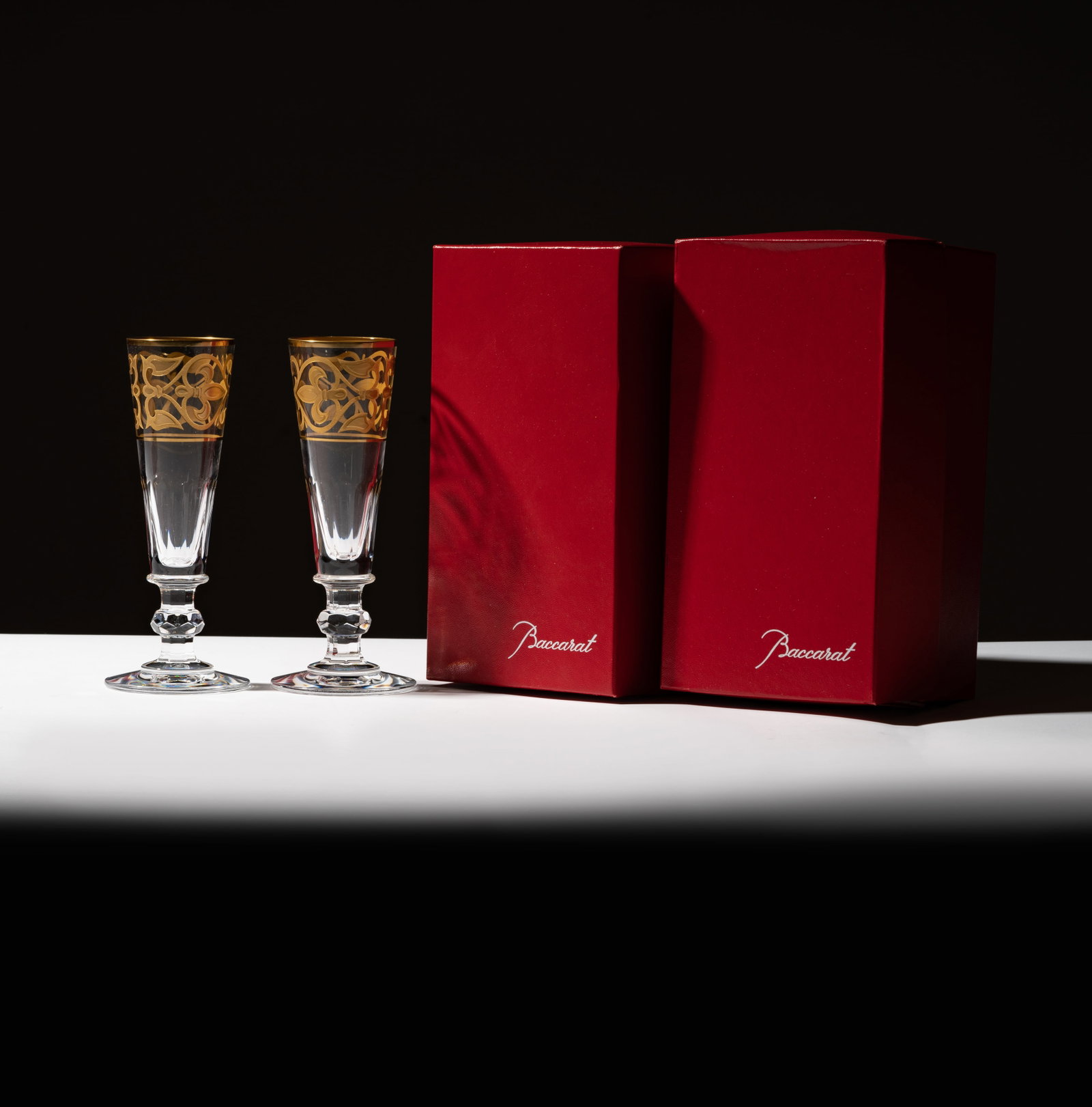 Eydie Gorme and Steve Lawrence: Pair of Baccarat Crystal Champagne Flutes: each with gilt decoration and original box; each with factory mark 6 7/8 in. (17.5 cm.) high Provenance: The Estate of American Pop Icons Steve Lawrence and Eydie Gorme