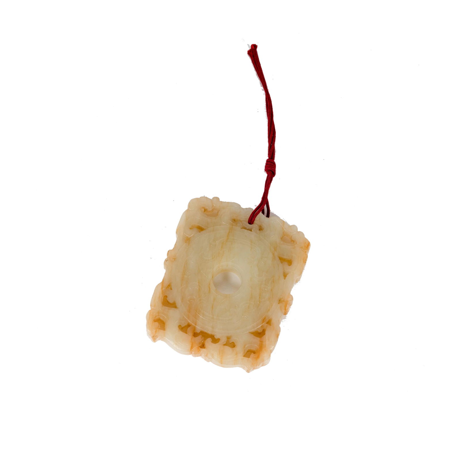 A Chinese Carved White Jade Toggle: 2 1/2 x 2 x 0 1/4 in. (6.4 x 5.1 x 0.6 cm.) Provenance: Property from the Bing Estate, Boston, Massachusetts