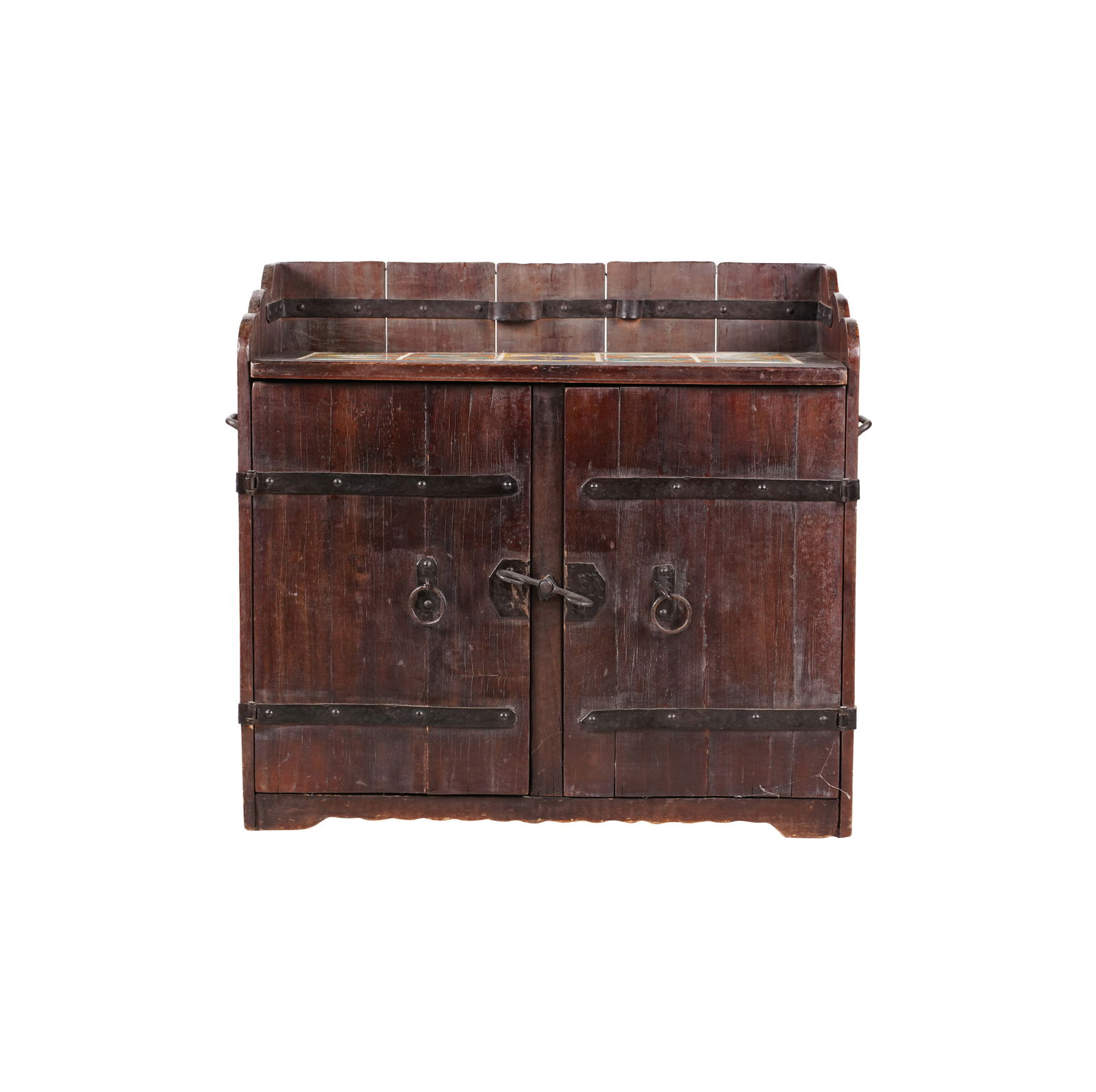 A Signed Monterey California Tile-Inset Prohibition Bar: California, 1920s; dark-stained wood with iron mounts, the top inset with ten glazed pottery tiles and sliding forward to reveal a hidden compartment, over a pair of doors enclosing a shelf; with bran