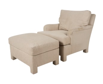 A Fully Upholstered Armchair and Ottoman