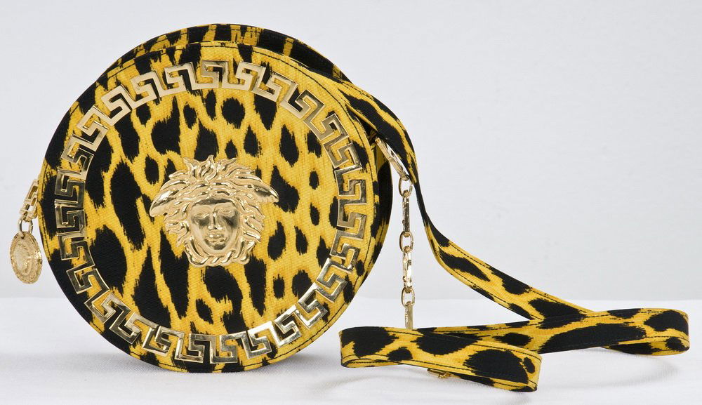 VERSACE YELLOW CHEETAH PRINT SHOULDER BAG: Yellow and black fabric round purse with gold tone hardware 7 inches diameter