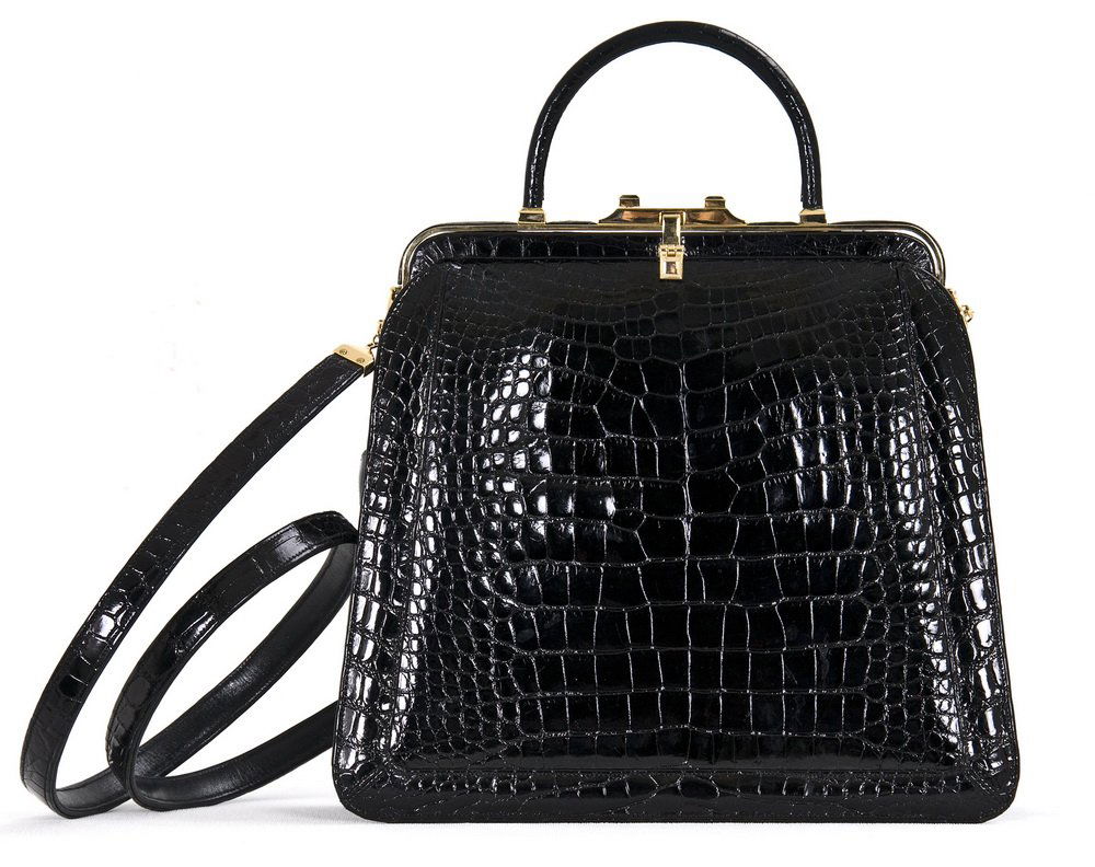 JUDITH LEIBER BLACK ALLIGATOR TOP HANDLE HANDBAG: Removable long shoulder strap; gold tone hardware; interior pocket; labelled "Judith Leiber New York" 8 inches high; 9 inches wide; 18 inch shoulder drop