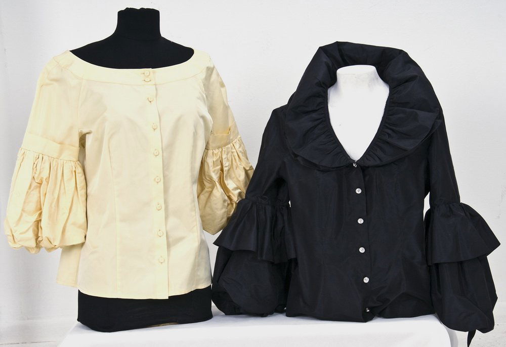 TWO ESCADA TAFFETA EVENING BLOUSES: Black long sleeve taffeta blouse with rhinestone buttons; pale yellow short sleeve blouse with self covered fabric buttons Size 38