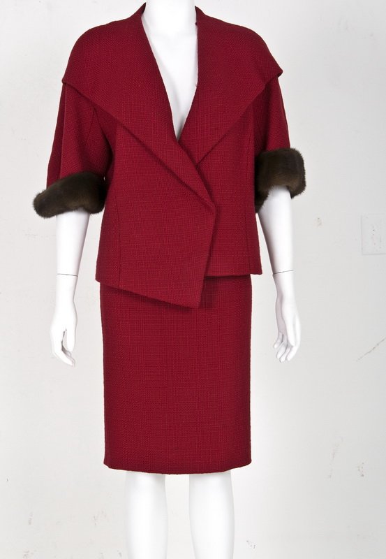 ESCADA RED JACKET AND SKIRT WITH FUR TRIM: Suit consisting of single button jacket with short sleeves trimmed in fur; straight skirt; self fabric belt Size 38