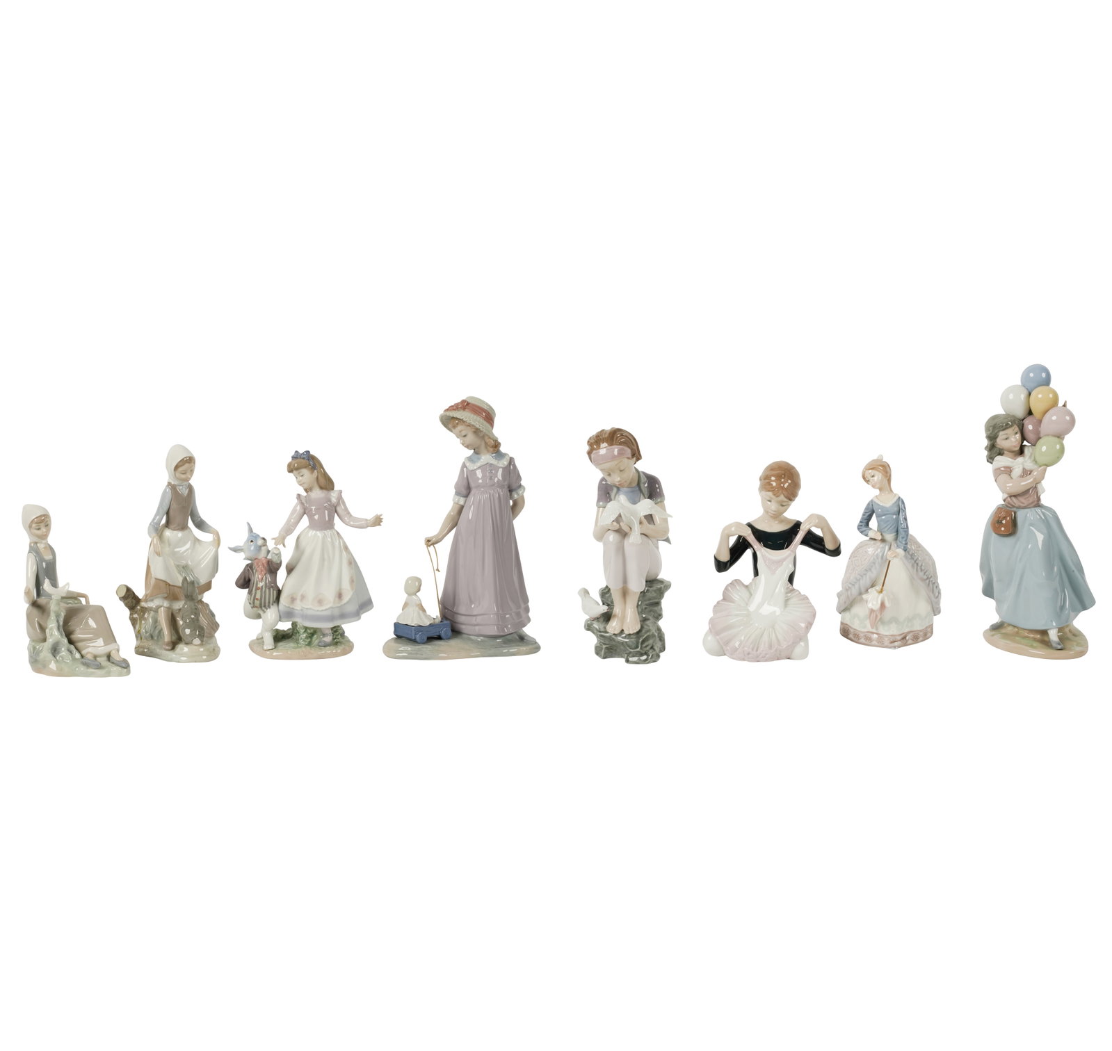 A Group of Lladro Porcelain Figures: Ranging from 7 in. high to 10 1/2 in. high [8 pieces]