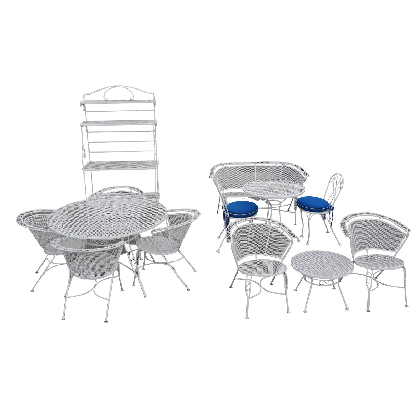A White-Painted Patio Furniture Suite: comprising a round table (29 x 47 1/4 in.), six armchairs (29 x 26 1/2 x 25 in., Seat height: 17 in.), a table (29 x 29 in.), two side chairs (33 x 15 x 16 in.), a chaise lounge, a settee, a side tabl