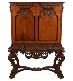 A Baroque-Style Carved Walnut Cabinet