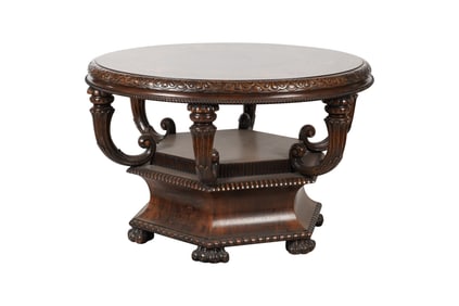 A Carved Walnut and Marquetry Center Table