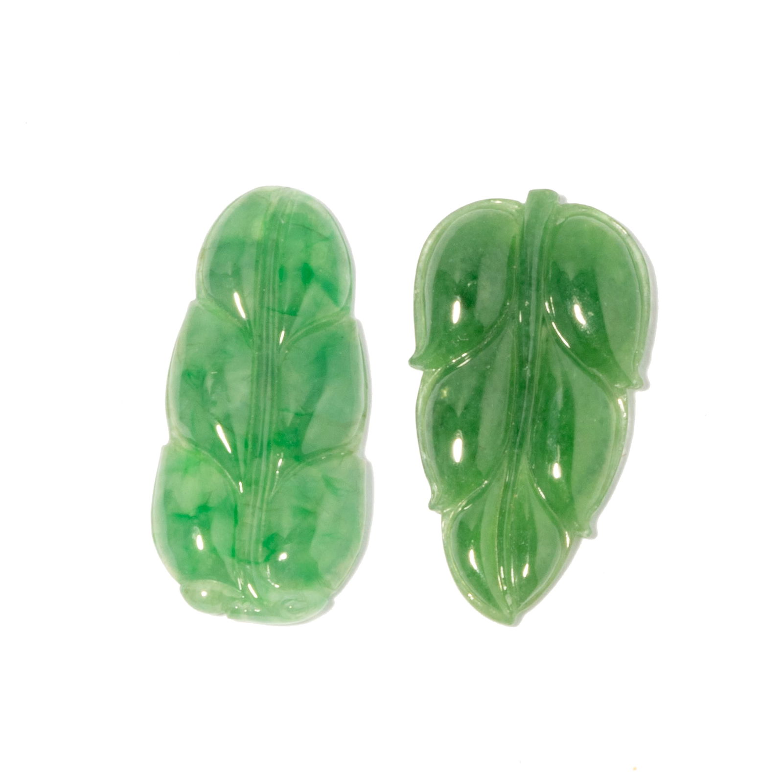 Two Type A Jade Leaf Carvings: each leaf with GIA reports; total jade weight 20.11 carats; GIA report: 2201843915, 2203843908;