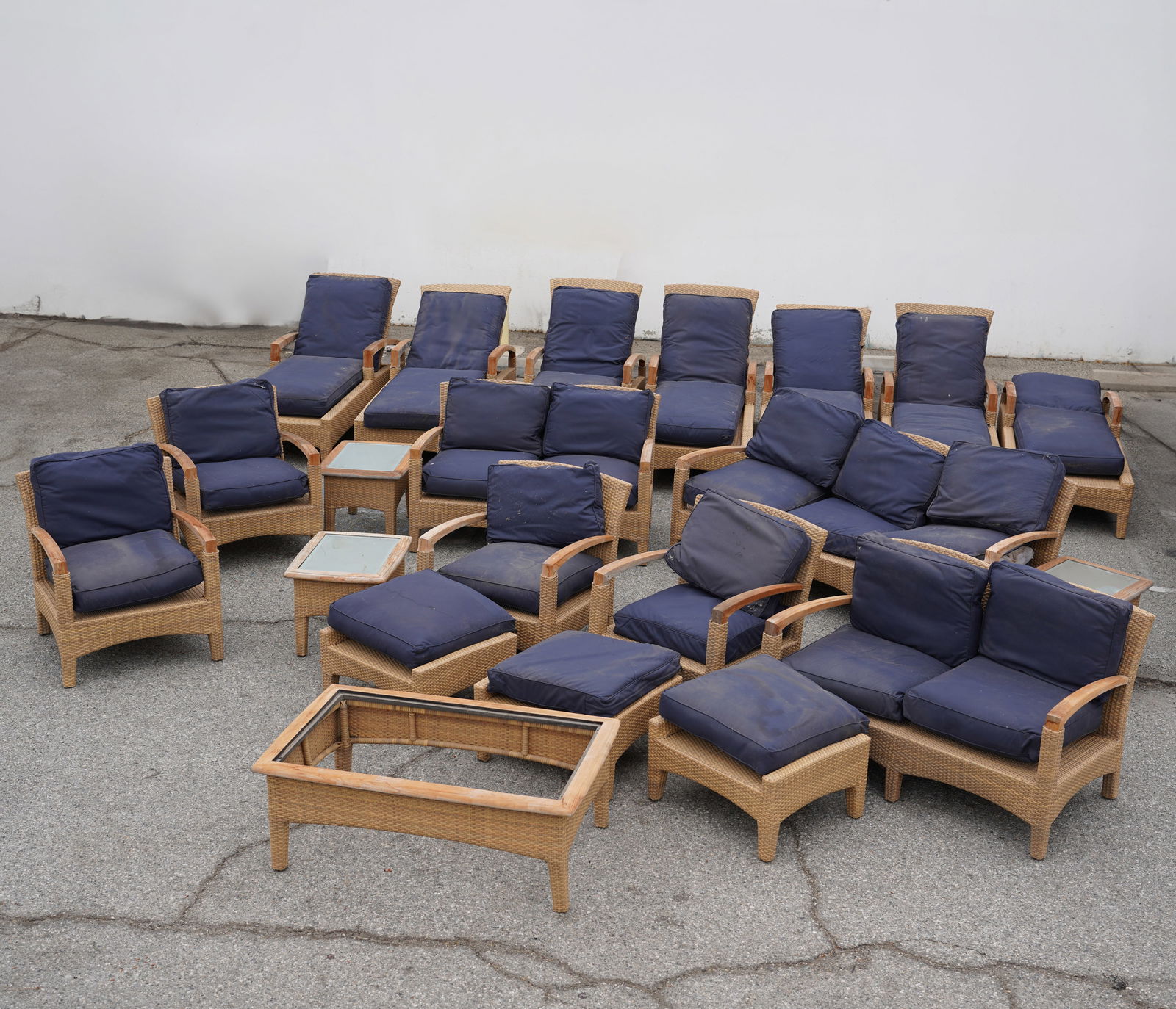 Gloster Set of Patio Furniture: comprising a sofa, two settees, four armchairs, six lounges, three ottomans, three side tables, and a coffee table [20 pieces] Provenance: The Sinatra House, Chatsworth, California, built in 1951 by W