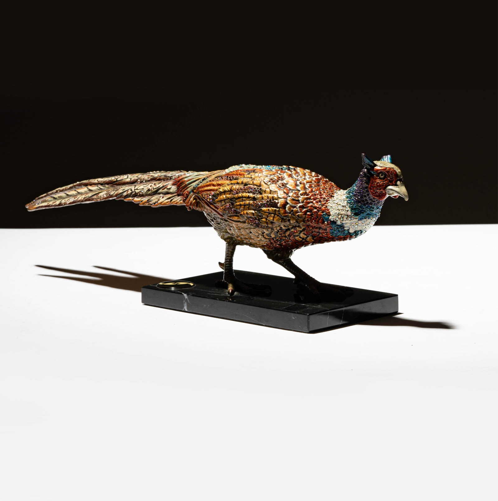 A Jay Strongwater Pheasant Figure: 2009; signed and numbered 58/300 Overall: 5 1/2 x 18 in. (14 x 45.7 cm.)