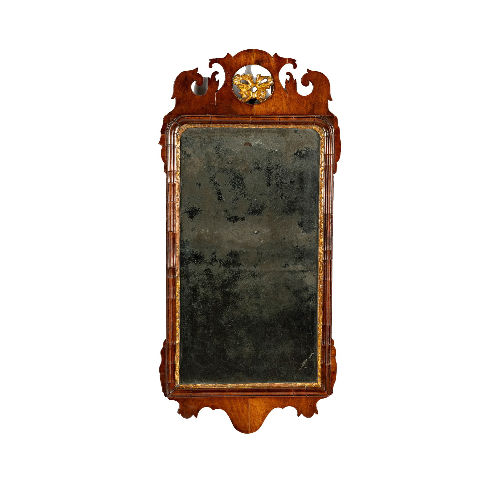 A Chippendale-Style Mahogany Mirror: with gilt accents 32 1/2 x 15 in. (82.6 x 38.1 cm.)