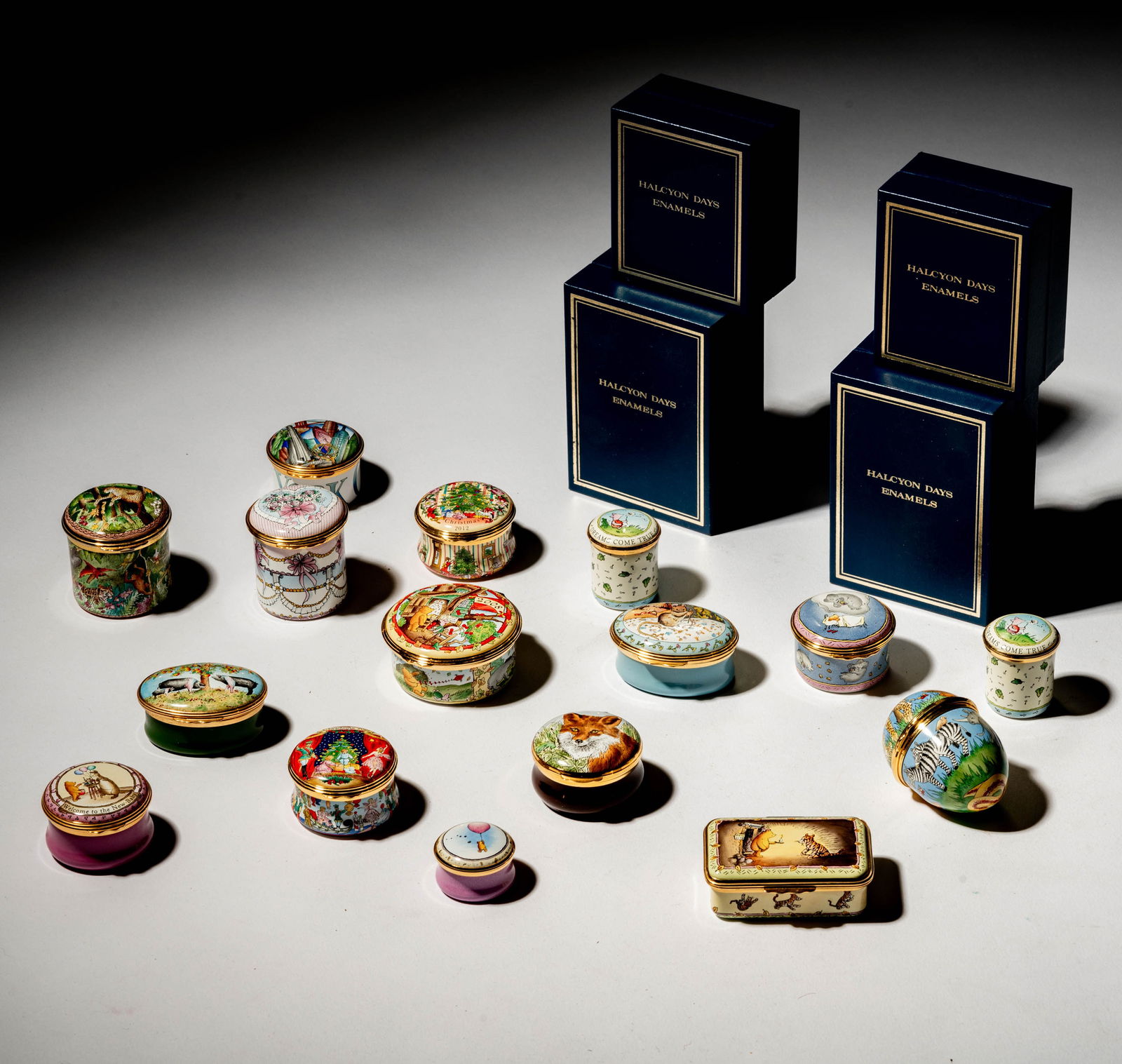 A Group of Halcyon Days Enamel Pill Boxes: Ranging from 1 in. high to 2 in. high [20 pieces]