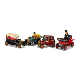 A Group of Four Vintage Battery Operated Tin Toy Cars