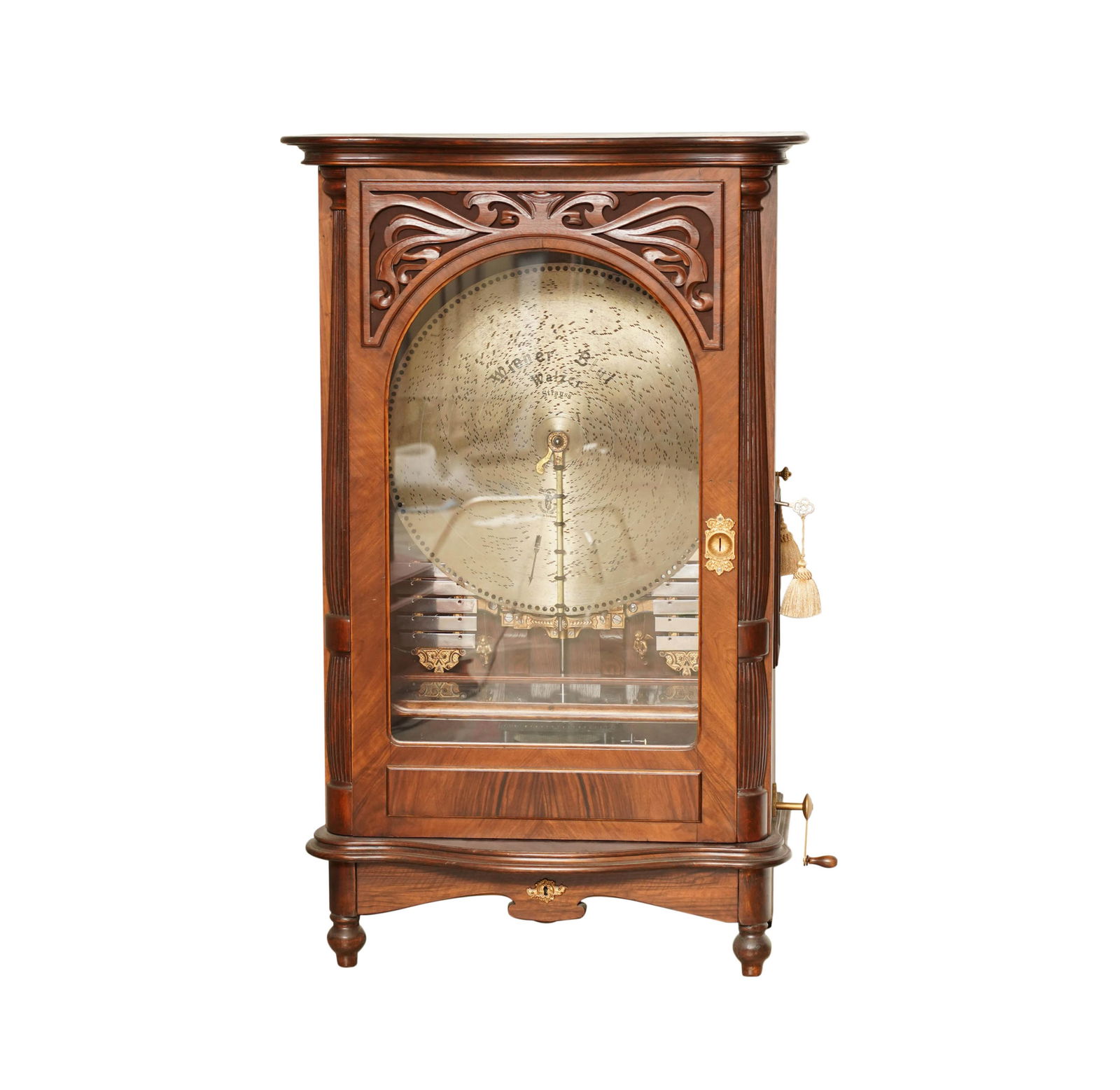 A Polyphon 6 Upright Music Box: pull out bottom drawer, winding tool and locking key; along with 16 discs with wooden box, view video of the Polyphon 6 here: https://youtube.com/shorts/V7lL1bMSkTU 50 1/2 x 31 x 18 in. (128.3 x 78.7