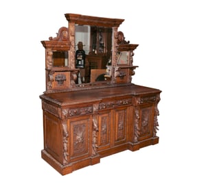 A Continental Carved Oak Mirrored Back Sideboard