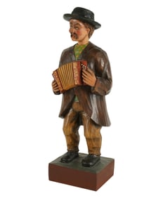A Wood-Carved Whistling Automaton with Accordion