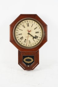 A Seth Thomas Mahogany Hexagon Calendar Dial Wall Clock