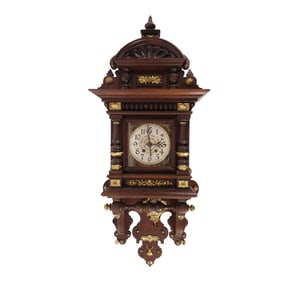 A Lenzkirch "Beatle" Carved Wood and Brass Wall Clock