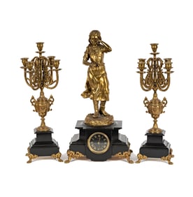 A French Gilt and Spelter Figural Mantle Clock with Candelabra