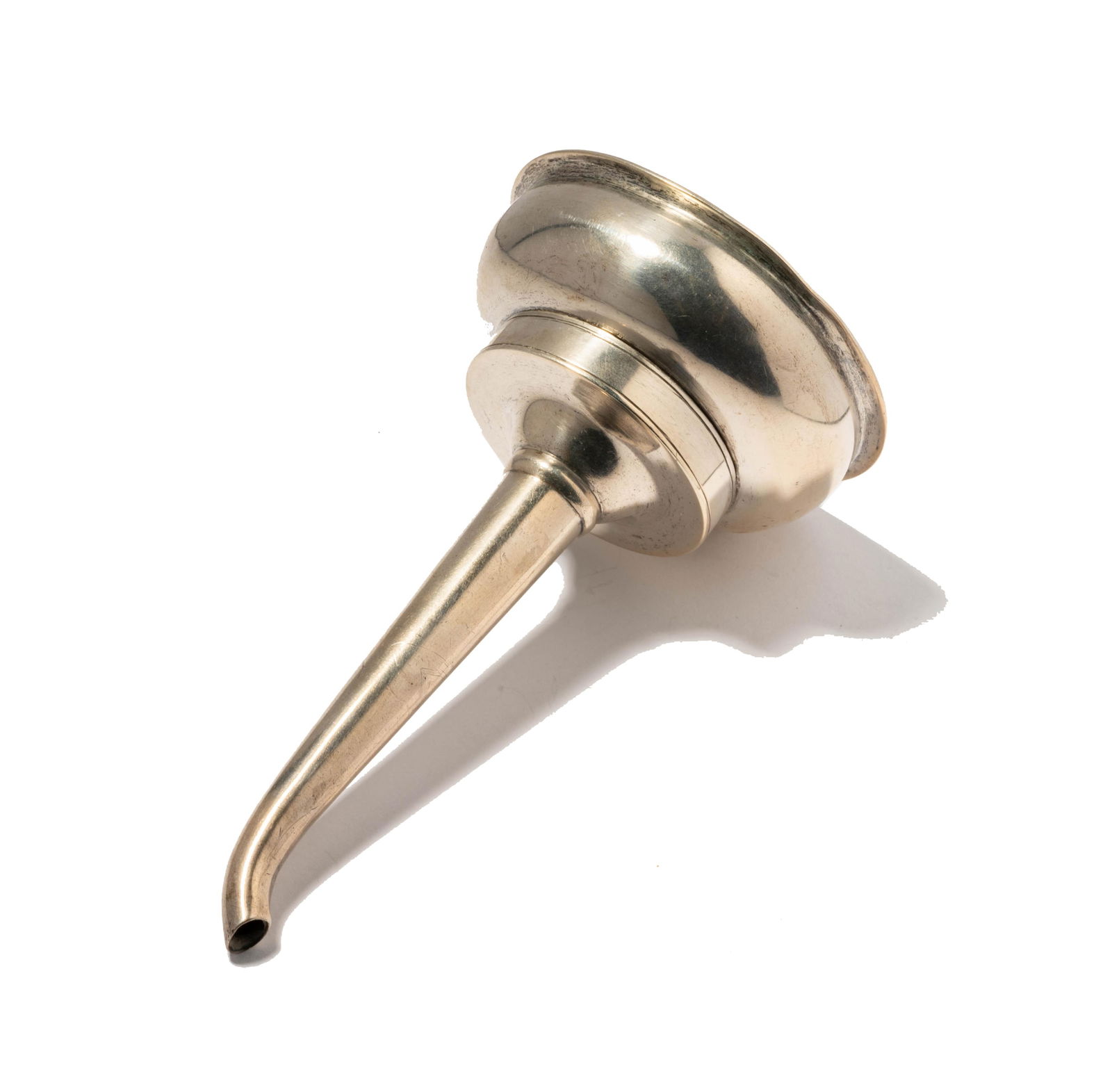 A Sterling Wine Funnel: with integral strainer and clip; unmarked (tests for sterling); Approximately 90 grams 6 x 3 in. (15.2 x 7.6 cm.)